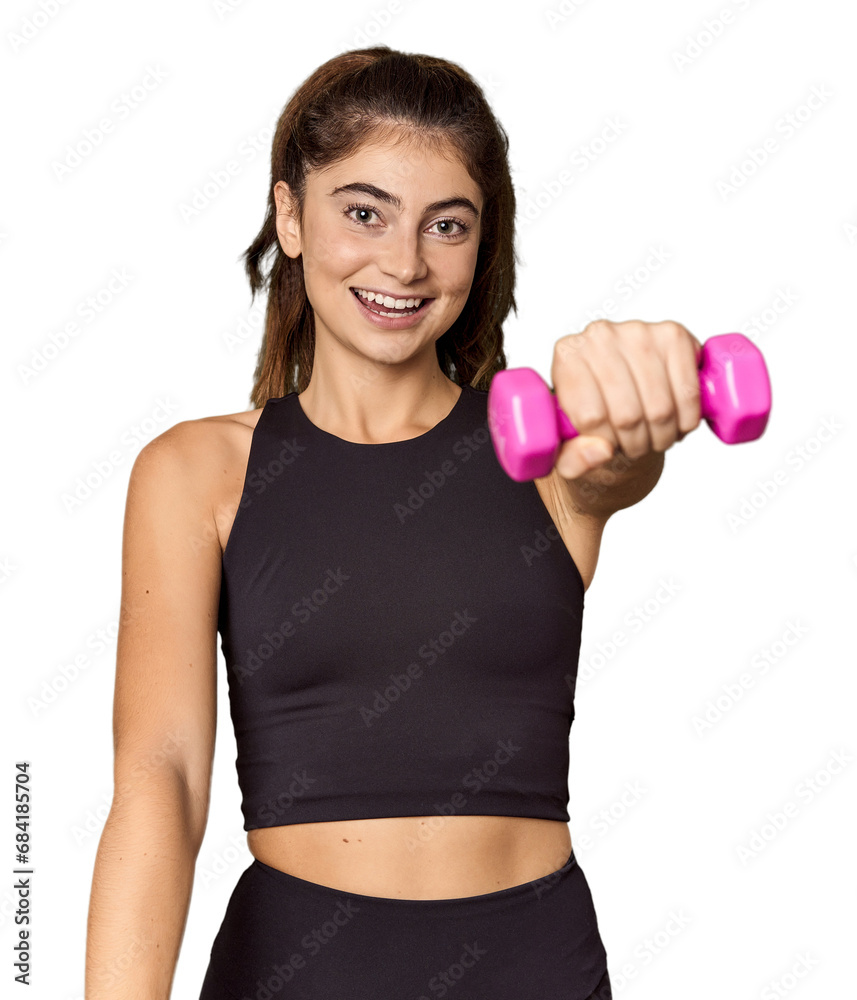 Caucasian athlete lifting lightweight dumbbells in studio Caucasian athlete lifting lightweight dumbbells in studio