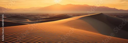 Dramatic desert landscape, expansive sand dunes under a setting sun, rippled texture
