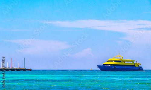 Boats yachts ship catamaran jetty beach Playa del Carmen Mexico.