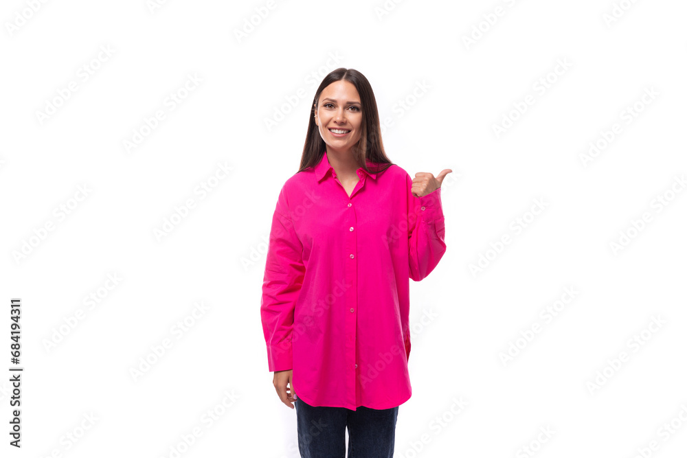 a smart caucasian woman with black straight hair is dressed in a crimson shirt with her index finger pointing at an empty space a smart caucasian woman with black straight hair is dressed in a crimson shirt with her index finger pointing at an empty space
