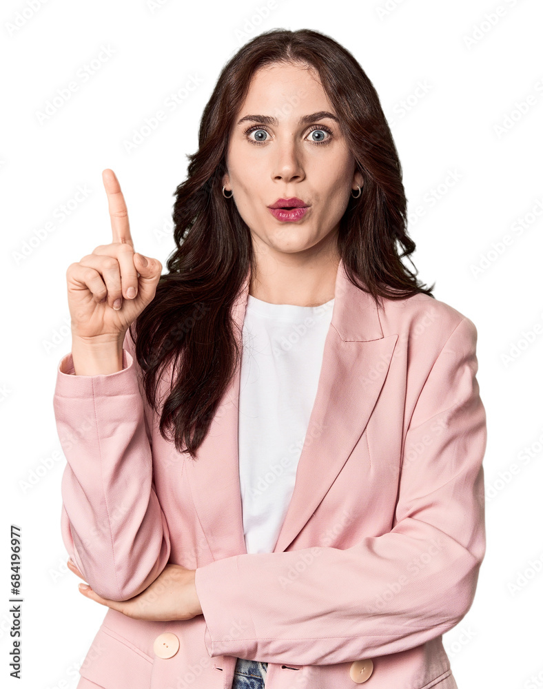 Young Caucasian woman in a studio setting having some great idea, concept of creativity. Young Caucasian woman in a studio setting having some great idea, concept of creativity.