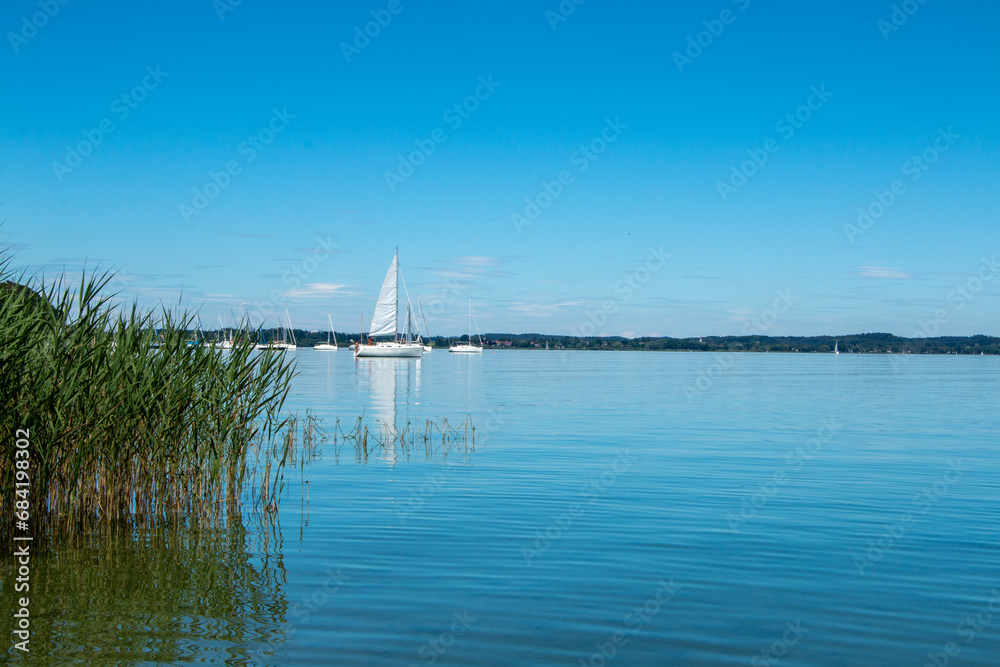 Sailboats on the Chiemsee in southern Bavaria on a calm, clear summer's day
