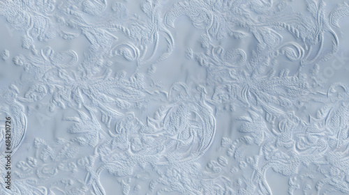 Seamless textured damask fabric with subtle paisley pattern in soft blue © Matthias