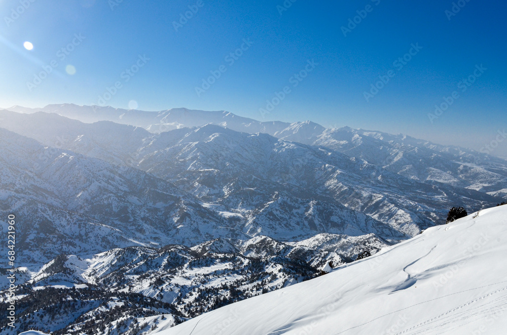 scenic view of  Nurekata valley and Chimgan mountains from Amirsoy ski resort (Tashkent region, Uzbekistan)