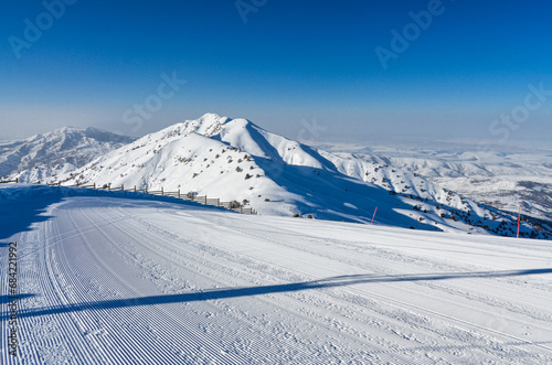 groomed ski run in Amirsoy ski resort (Tashkent region, Uzbekistan) © ssmalomuzh