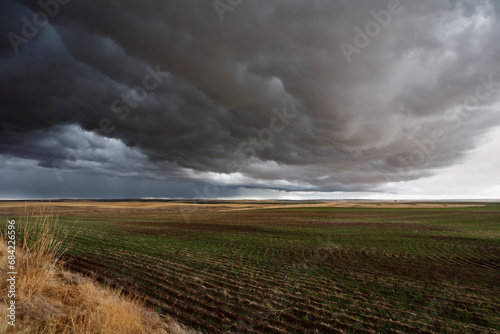 A huge thundercloud above fields of Montana