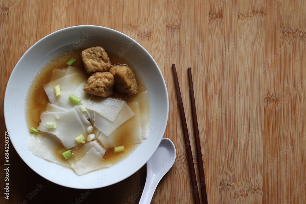 Tofu Noodle Vegan Vegetarian food. Street food rice noodle Chinese five spice soup. Healthy food concept