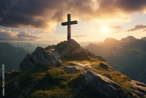 Wooden cross on the top of the mountain with clouds on the background
