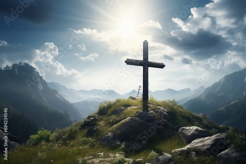 Wooden cross on the top of the mountain with clouds on the background