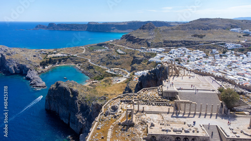 The Acropolis of Lindos in Rhodes island Greece. Saint Paul's Beach and Lindos Acropolis aerial panoramic view.