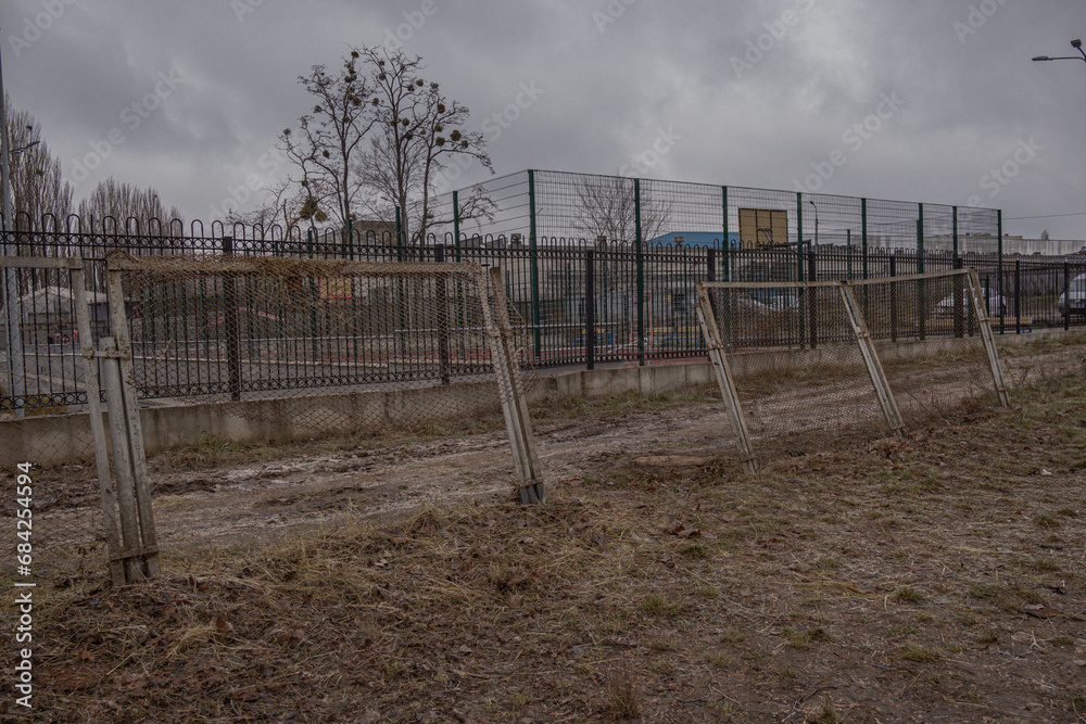Kyiv, Ukraine - November 26, 2023: A strong blast wave damaged a fence Kyiv, Ukraine - November 26, 2023: A strong blast wave damaged a fence