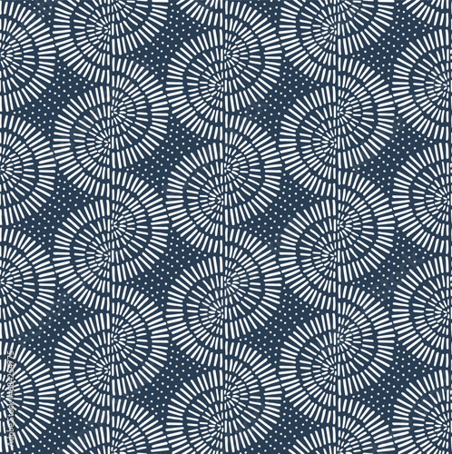 Stripes of dashed line squiggles , hand drawn geometric boho chic  dotted marks sunburst archs circular shapes arranged in wavy stripes pattern design  in navy indigo blue and white color palette. photo