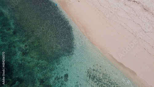 An aerial drone shot of a beach in Bali, Indonesia