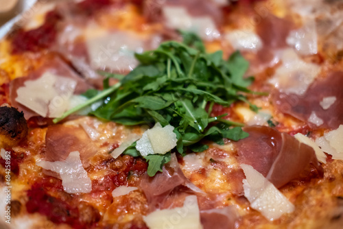 Close-up of Parma Ham Pizza on the table.