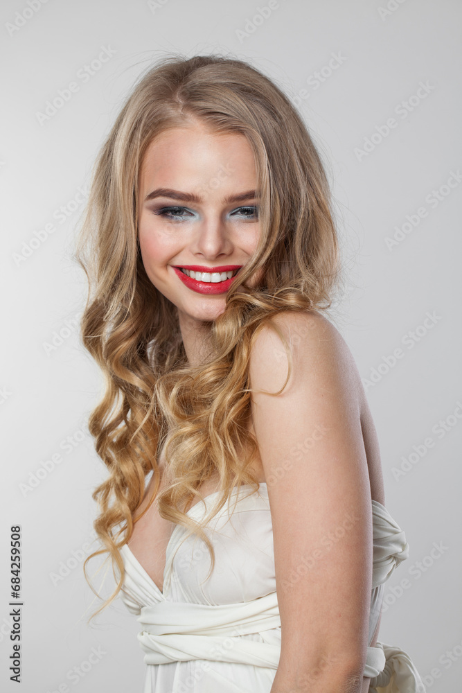 Happy lady with curly hairdo standing on white background. Beauty woman portrait Happy lady with curly hairdo standing on white background. Beauty woman portrait