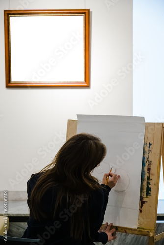 Young artist woman painting sketch