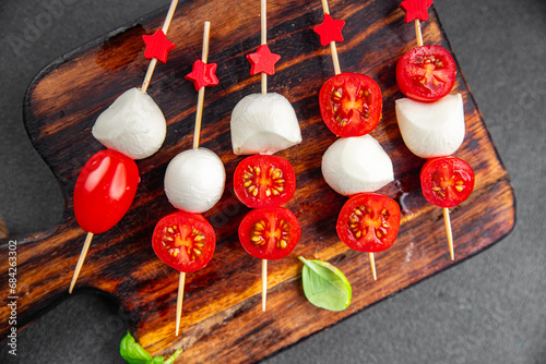 Caprese mozzarella tomato appetizer salad skewer finger food eating cooking appetizer meal food snack on the table copy space food background rustic top view