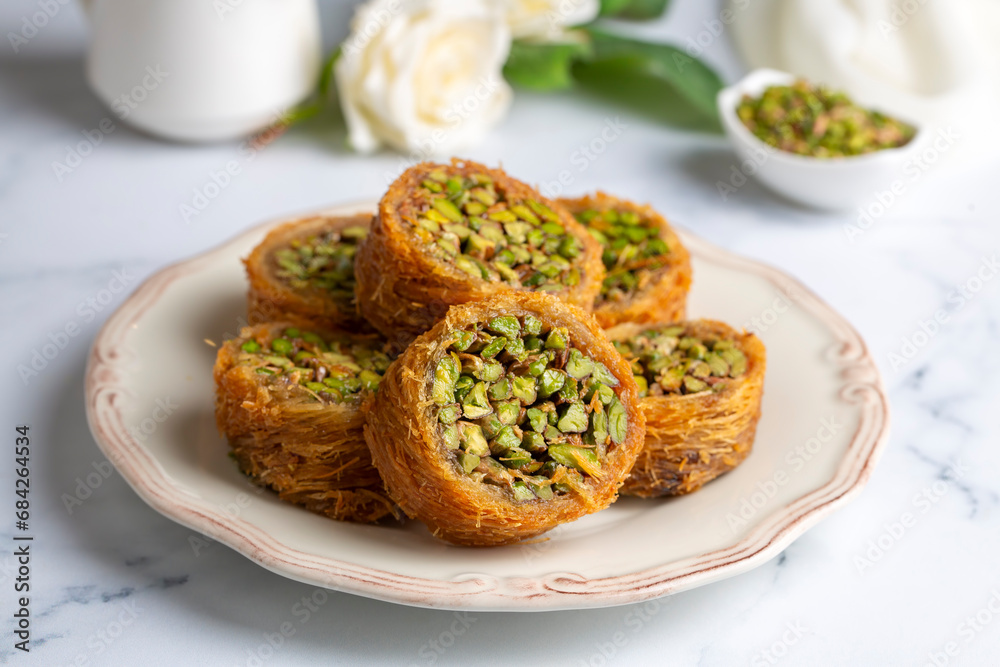 Traditional Turkish desserts; Kadaif stuffed with pistachios. Turkish name; Kadayif dolmasi or dolma kadayif. Halep sarma, halep sarmasi.
