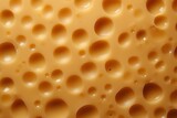Background with cheese texture, close-up view from above, background with porous cheese.