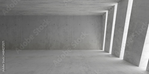 Abstract empty, modern concrete room with diagonal light stripes openings in the wall, pillar and rough floor - industrial interior background template