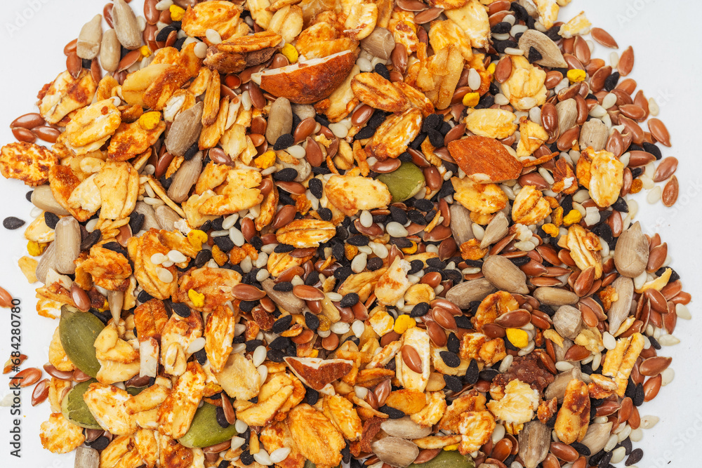 mixed seeds on a light background. mix of cereals for a healthy diet on a white background. assorted cereals for granola mixed seeds on a light background. mix of cereals for a healthy diet on a white background. assorted cereals for granola