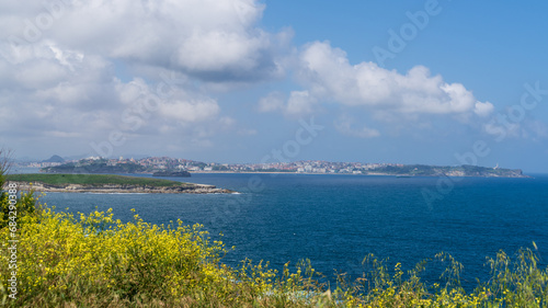 View towards Santander and Isla de Jorganes, at the horizon to the right is the lighthouse Cabo Mayor, Cantabria, Spain