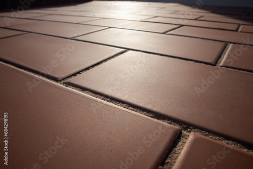 tiled floor, close-up of reddish tiles, geometric lines