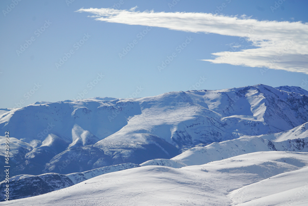 View of a snow-covered mountain, pure white on a beautiful winter day. View of a snow-covered mountain, pure white on a beautiful winter day.