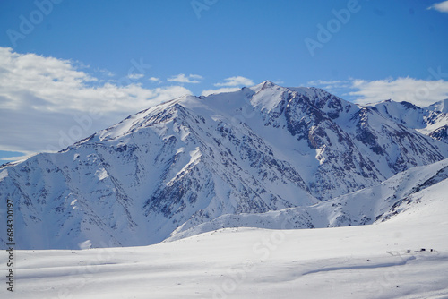 Scenic view of a snow-covered mountain on a beautiful winter day. Andes mountain range, Chile. © Emilia