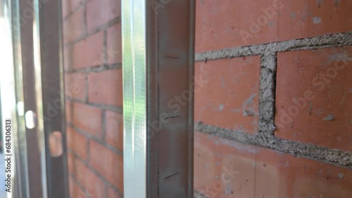 Metal structure for cavity wall insulation in walls and brick structure photo