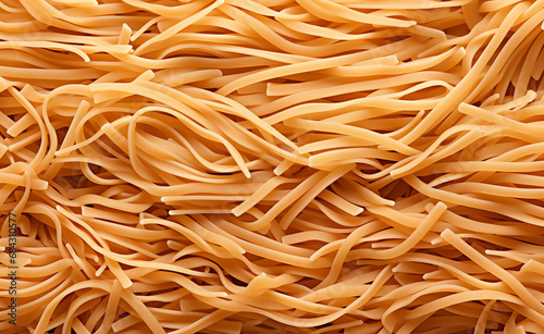 Freshly cooked homemade strand pasta, specifically spaghetti, to create a texture suitable for use as a background or wallpaper