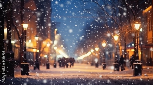 Beautiful blurred street of festive night or evening city with snowfall and Christmas lights © Denis