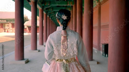 A graceful smile in traditional Hanbok at Changdeokgung palace, capturing the beauty of Korean culture