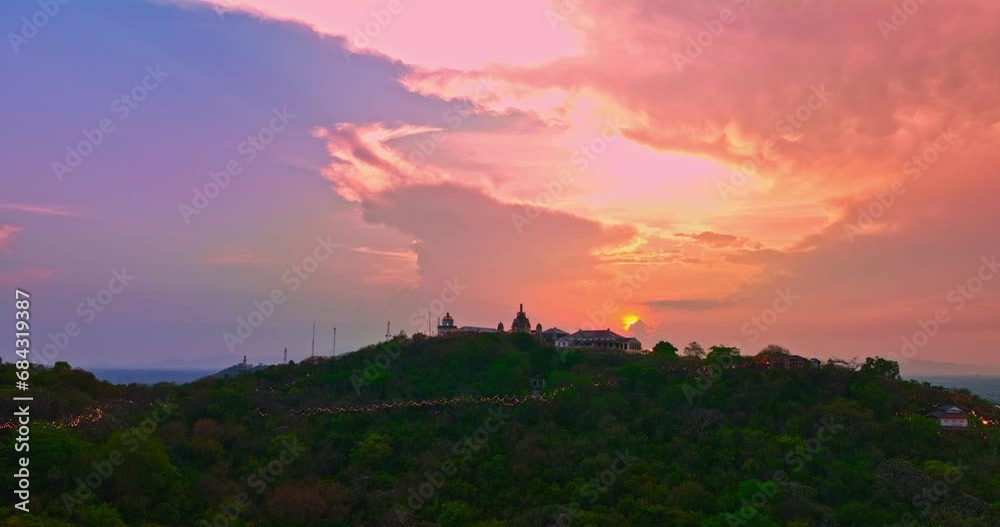 .Aerial view Huge, brightly colored clouds curled into a spiral above the castle..amazing cloud in bright sky at sunset above the palace on hilltop.Phetchaburi city background. cityscape background .Aerial view Huge, brightly colored clouds curled into a spiral above the castle..amazing cloud in bright sky at sunset above the palace on hilltop.Phetchaburi city background. cityscape background