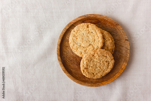 Oatmeal cookies on a wooden plate