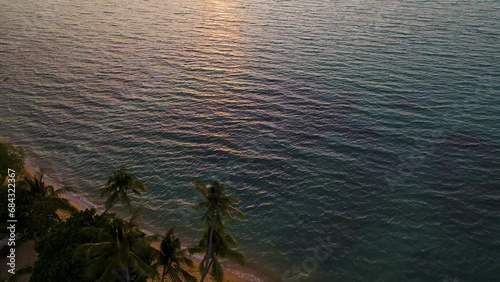 Cinematic aerial overview of exotic beach at sunset in Koh Samui, Thailand