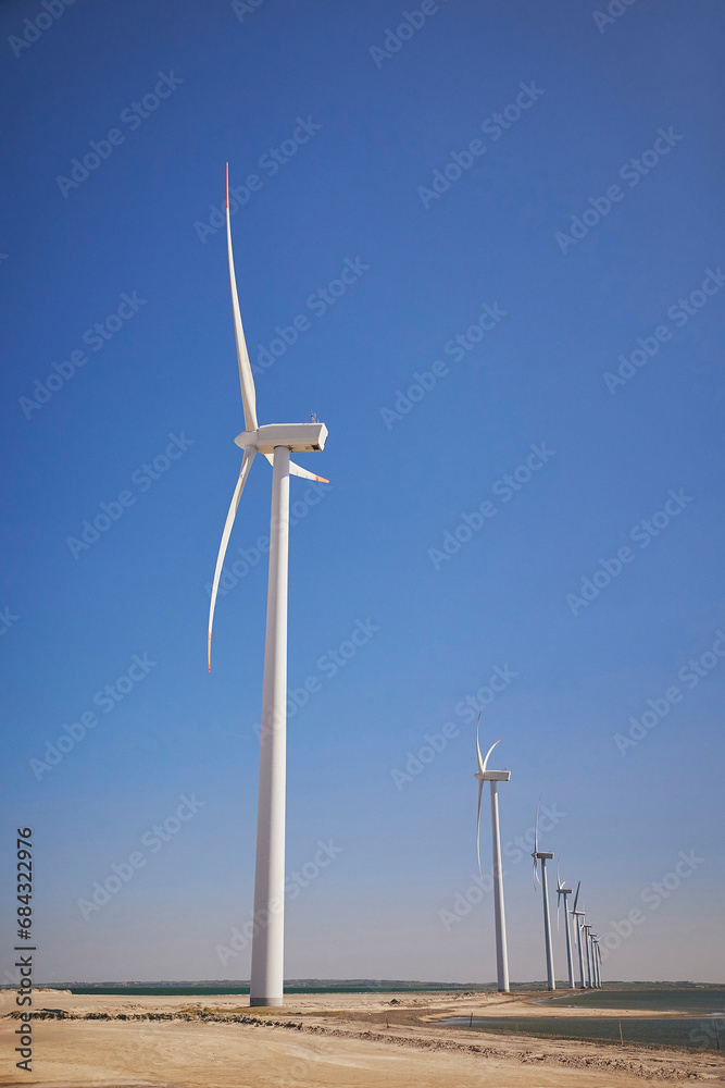 Wind turbines in the North Sea in Denmark at sunset. Wind turbines in the North Sea in Denmark at sunset.