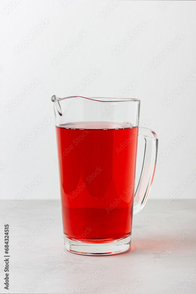 Red color drink in the glass jug Red color drink in the glass jug