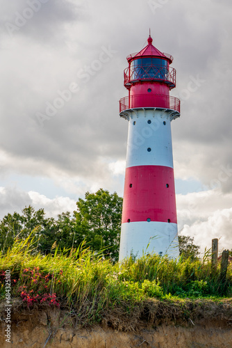 Lighthouse on the Baltic Sea with an overcast sky.