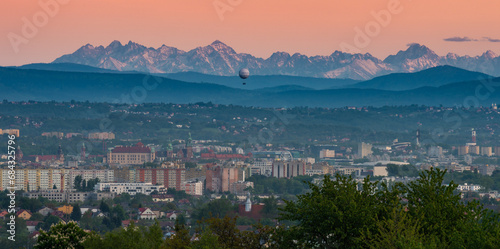 Krakow cityscape in the valley, with Beskidy and Tatra mountains in the background in the evening, Poland, Europe