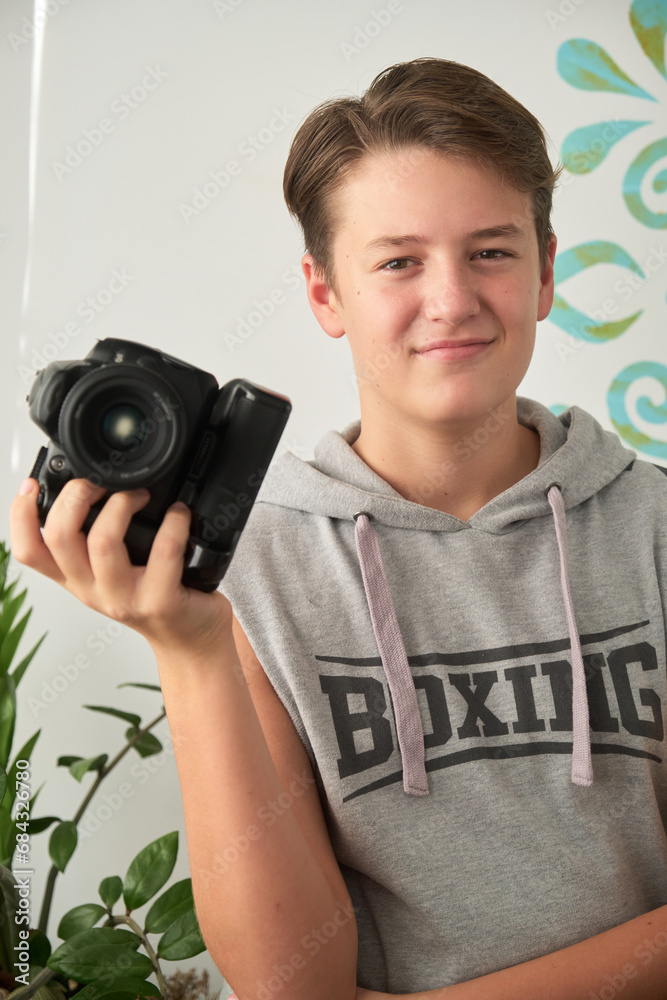 a boy with camera in his hands a boy with camera in his hands