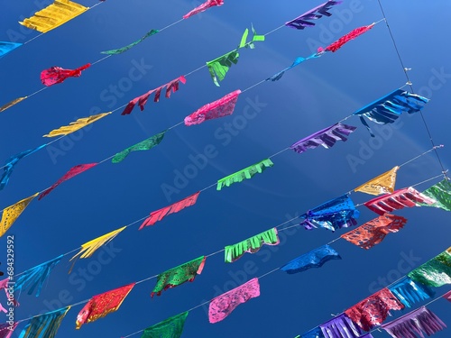 Colorful Papel Picado flags/banners hanging in the streets of Oaxaca, Mexico