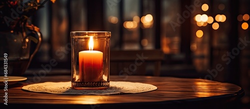 A candle on a dining table