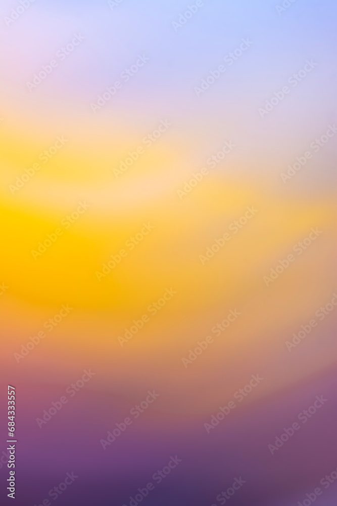 Colorful blurred abstract lilac yellow purple defocused background.