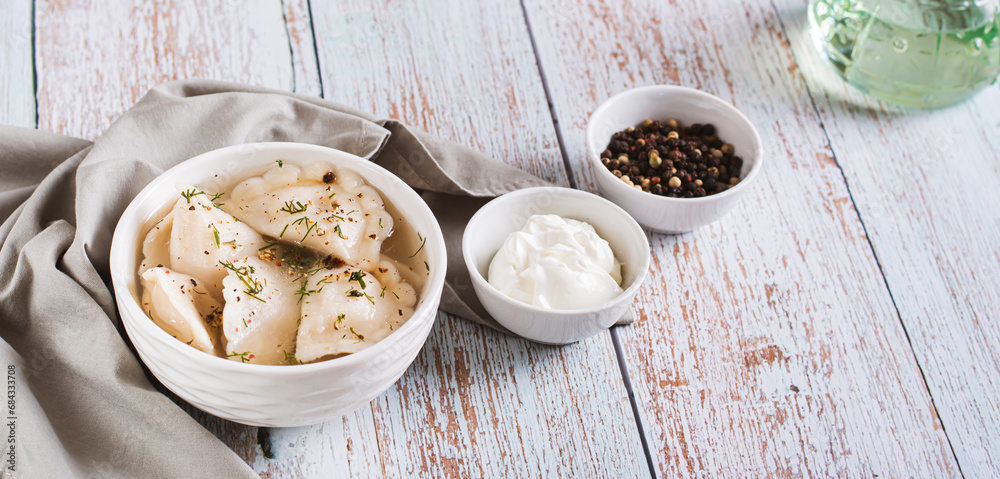 Traditional dumplings soup with herbs and spices in a bowl on the table web banner