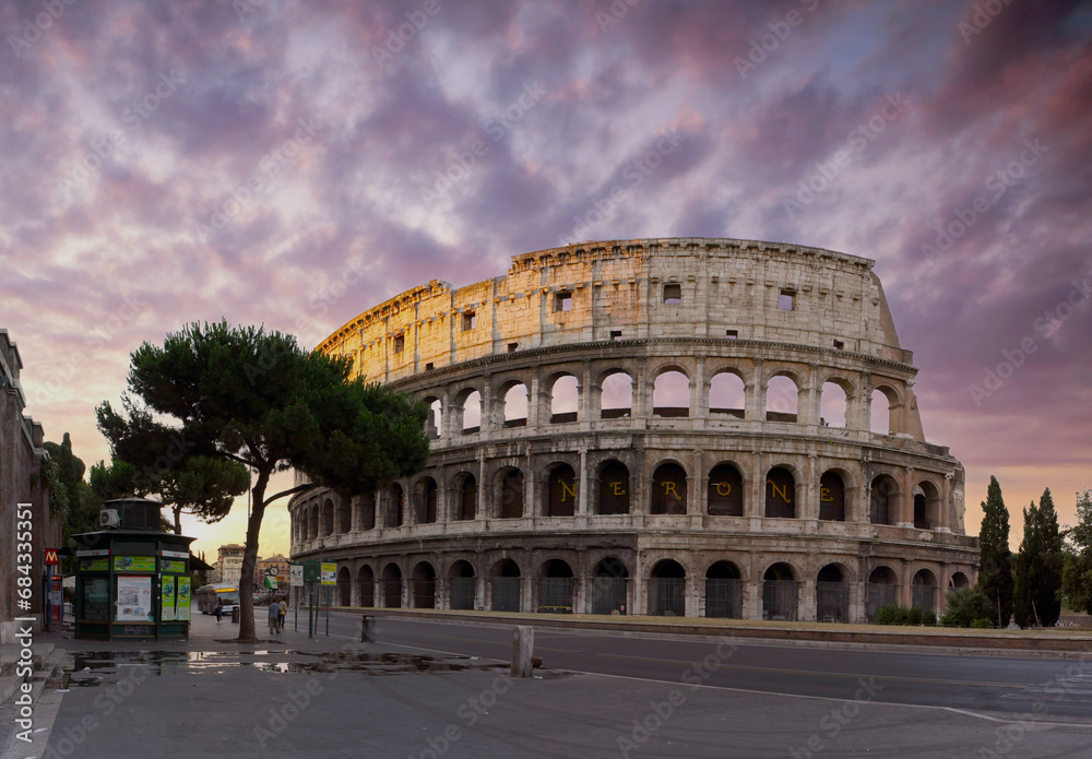 Ancient Colosseum in Rome at dawn.