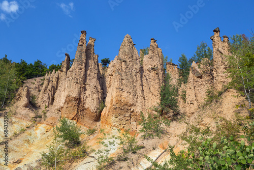 Devil's town (Djavolja Varos), front view of sandstone structures with stones on top. Interesting rock formations made by strong erosion on Radan mountain in Serbia. Background. Wallpaper.