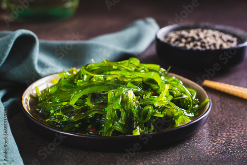 Traditional fresh seaweed and sesame salad on a plate on the table