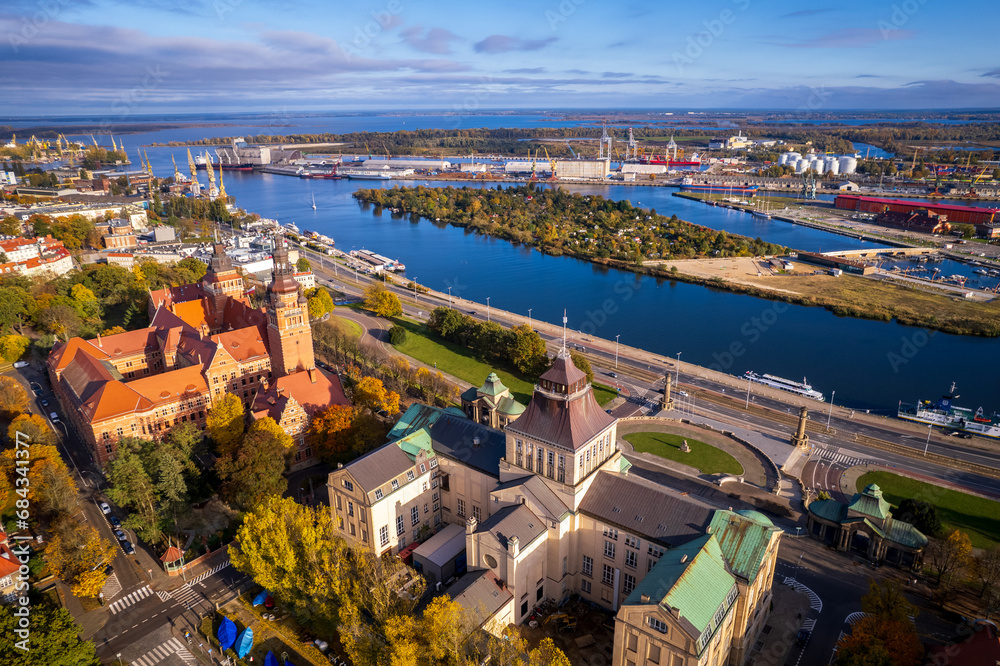 Szczecin from a bird's eye view on a sunny day. View of the city from the Oder River. City buildings, the seaport in Szczecin and its most characteristic places. - obrazy, fototapety, plakaty 