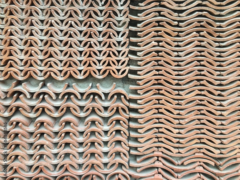 Clay tiles stacked into a wall Clay tiles stacked into a wall